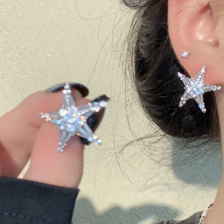 Women's glamorous zirconia star earrings & ear cuff set. Silver-tone, sparkly celestial jewelry for a stylish look.