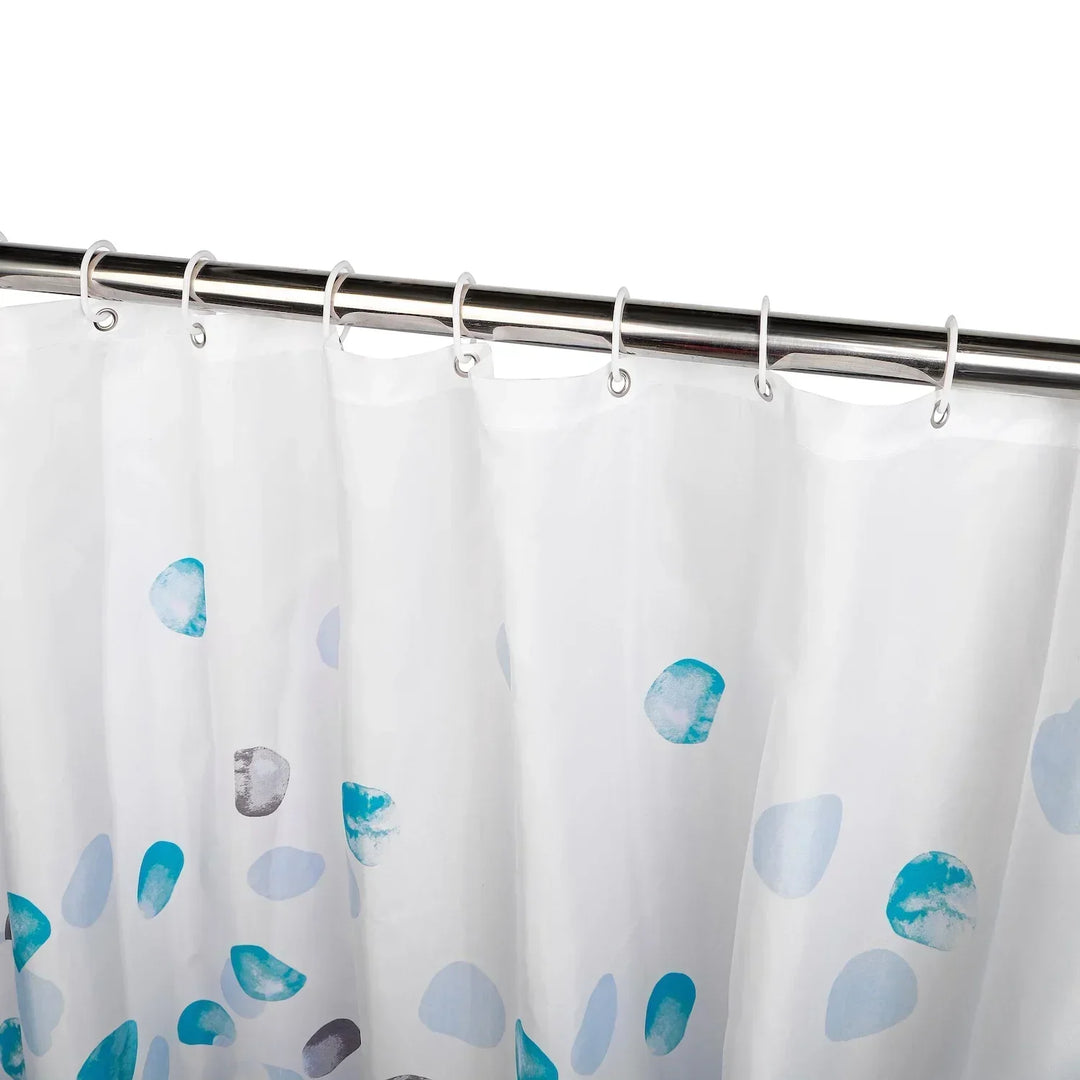 Folded SplashDot fabric shower curtain, showing compact storage and travel-friendly design