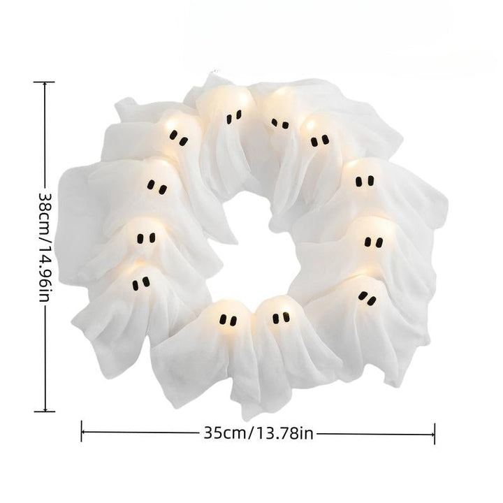 Decorative spooky Halloween wreath featuring whimsical ghost figures, intertwining dark branches, and battery-operated LED lights.