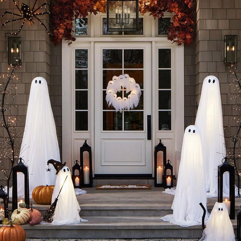 Halloween wreath with multiple white ghost figures, illuminated by bright LED lights, designed for spooky outdoor or indoor decor.