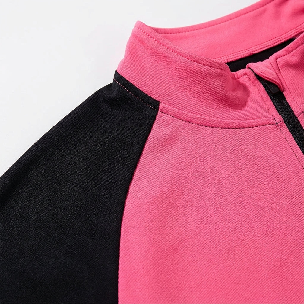 Close-up of a women's sporty cycling jacket with performance fabric and bike gear details