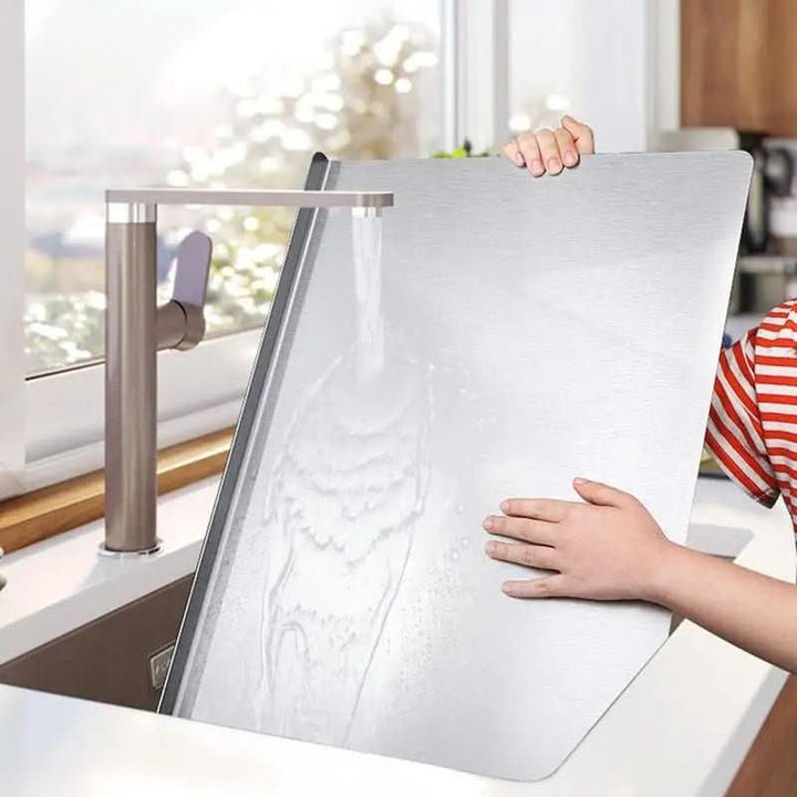 Premium stainless steel cutting board, hygienic & durable for kitchen tasks. Non-slip base, integrated lip design.