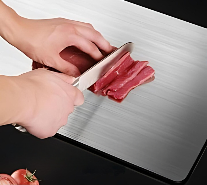 Stainless steel kitchen cutting board for hygienic food prep. Durable, rust-resistant, and antibacterial surface.