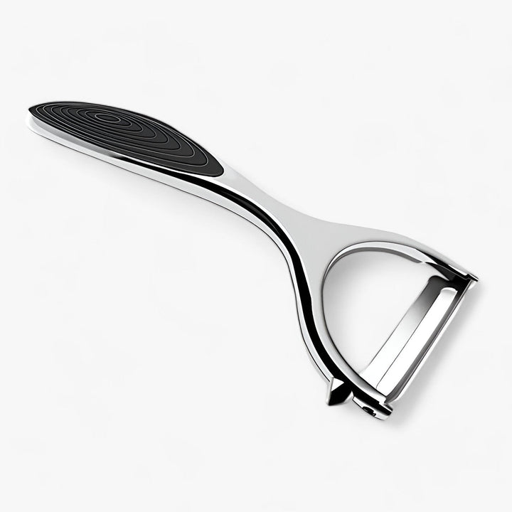 Stainless steel kitchen peeler & slicer for vegetables and fruits. Durable food prep tool.