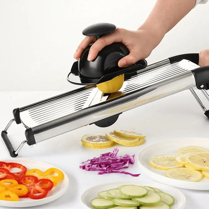Stainless steel mandoline slicer for vegetables & fruits. Adjustable blades for kitchen food prep.