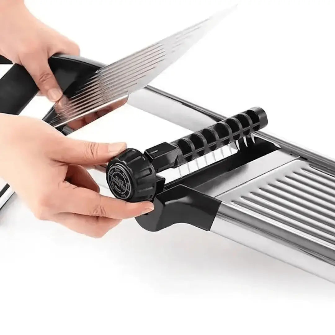 Stainless steel mandoline slicer in use for crisp veggie slices. Essential kitchen tool for meal prep.