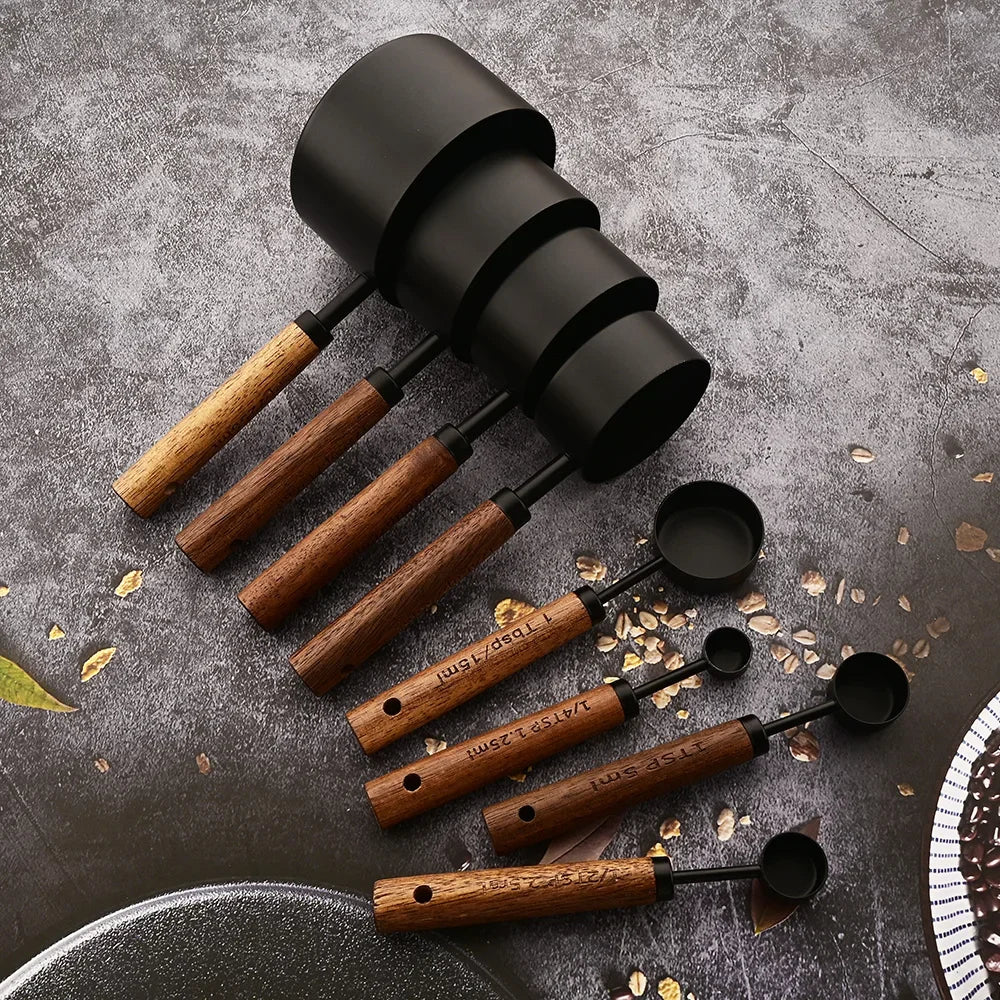 Stainless steel measuring spoon set with elegant wood handles for precise kitchen baking & cooking.