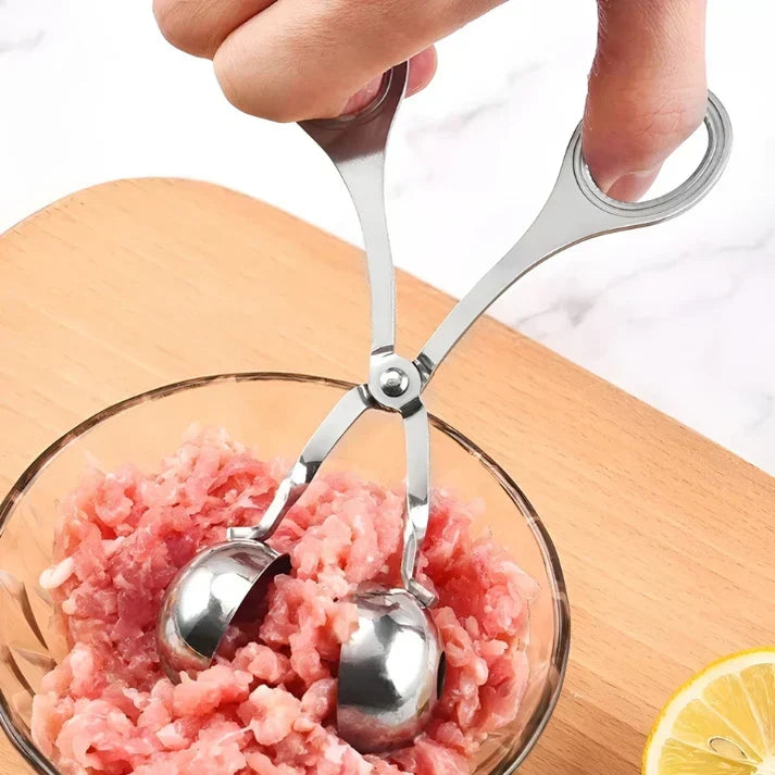 Effortless meatball making with this stainless steel kitchen gadget, ideal for quick food prep.