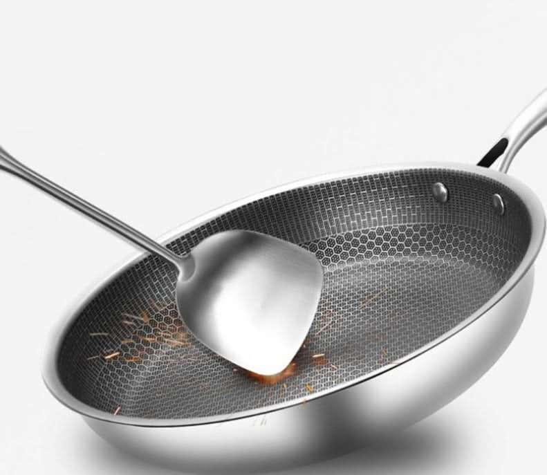 Sleek non-stick stainless steel frying pan, ideal for versatile kitchen cooking & uniform heat distribution.
