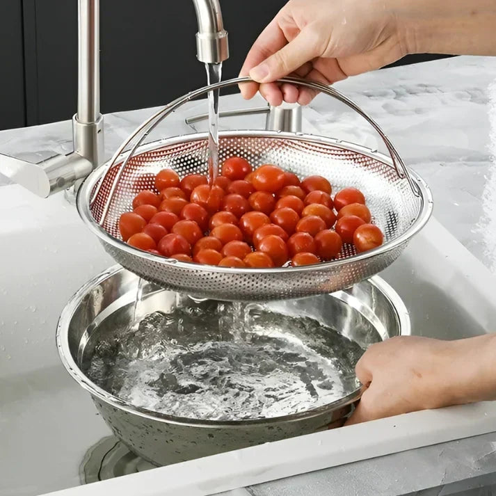 Stainless steel steamer basket for healthy cooking of vegetables, fish & dumplings. Foldable design, kitchen tool.