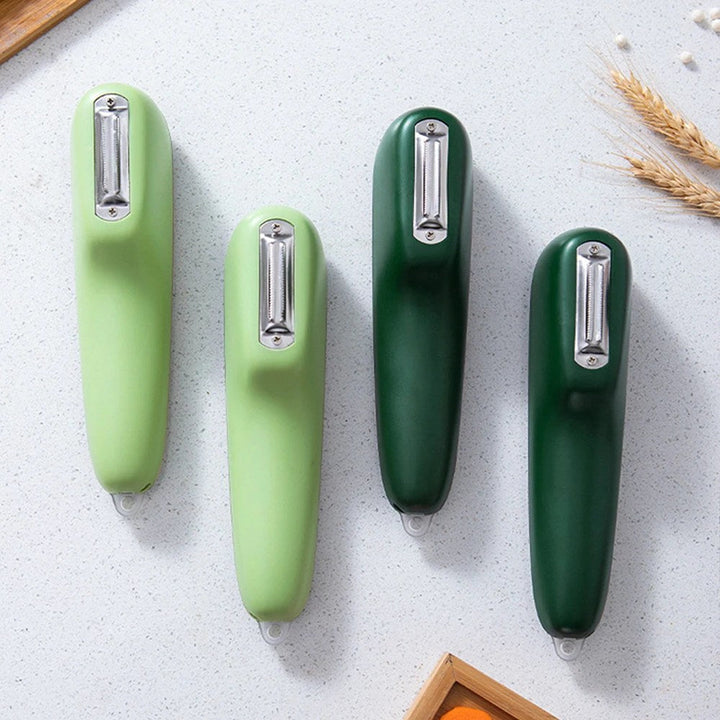 Durable stainless steel kitchen tool, a vegetable & fruit peeler with an integrated container for tidy and quick peeling.