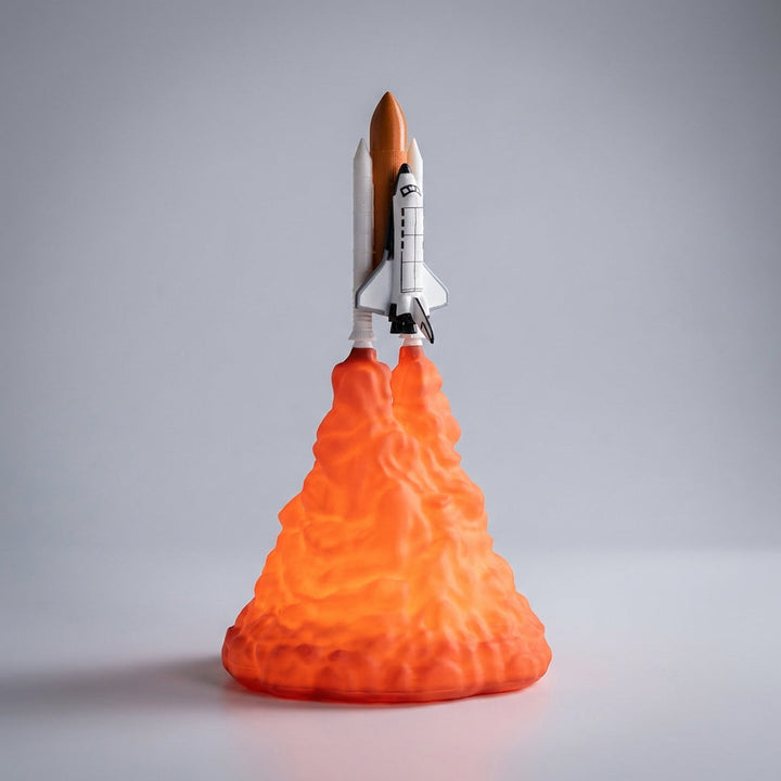LED rocket nightlight casting a gentle glow, ideal for a nursery or child's bedroom.