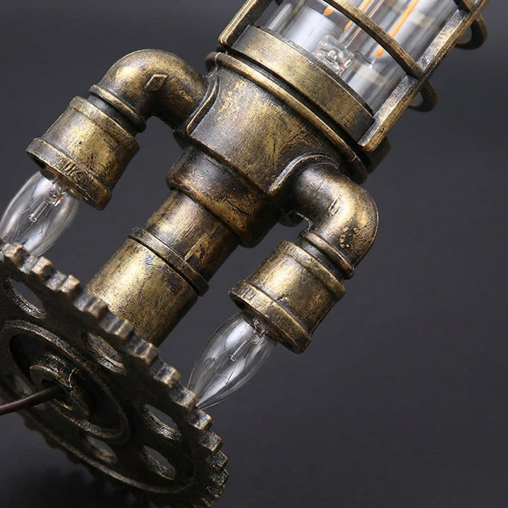 Close-up of Steampunk Rocket Table Lamp Aetherock, showcasing intricate design and warm vintage lighting
