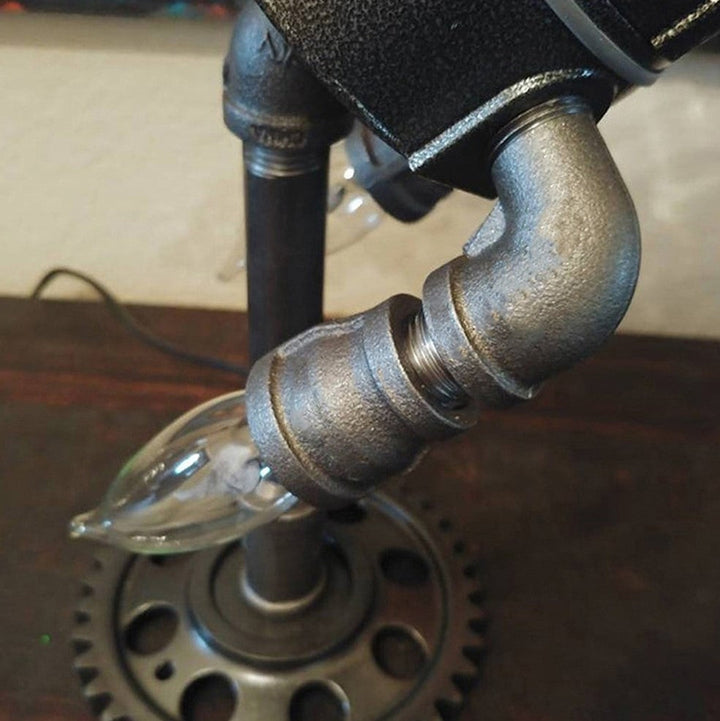 Stylish Steampunk Rocket Table Lamp providing unique ambient light, a focal point for any desk or room