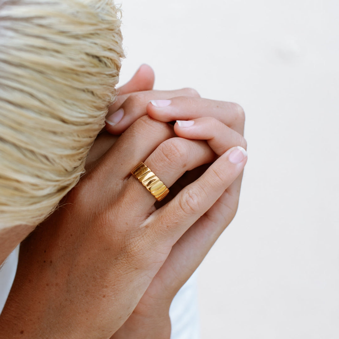 Chic silver statement ring for women, a bold metal accessory offering modern, elevated style.