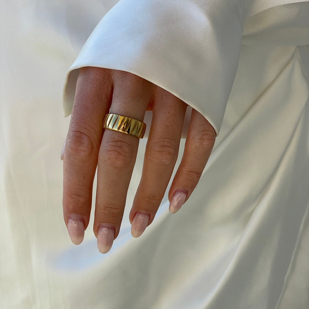Gift for her: Bold gold women's statement ring, a stylish metal accessory for modern, elevated style.