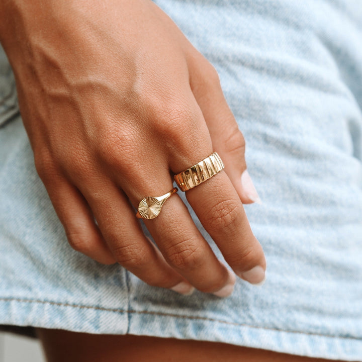Stella bold statement ring, a gold metal women's accessory for a striking, modern fashion look.