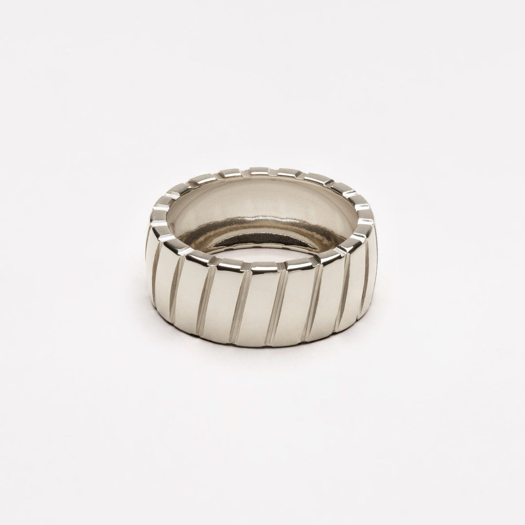 Women's chic silver statement ring, a bold metal accessory for modern jewelry & elevated style.
