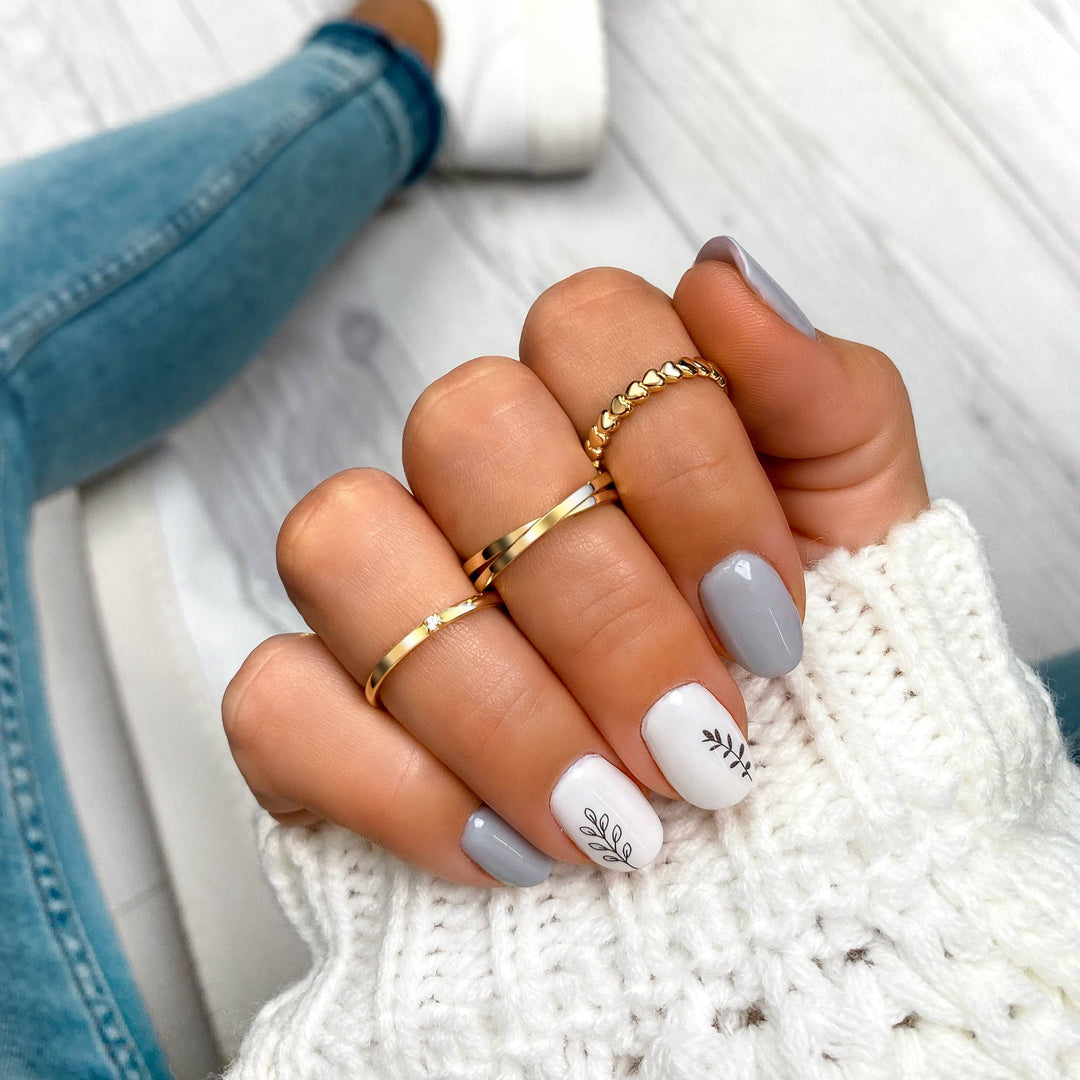 Elegant gold plated Aurora heart ring on a woman's finger, romantic accessory, gift for her.
