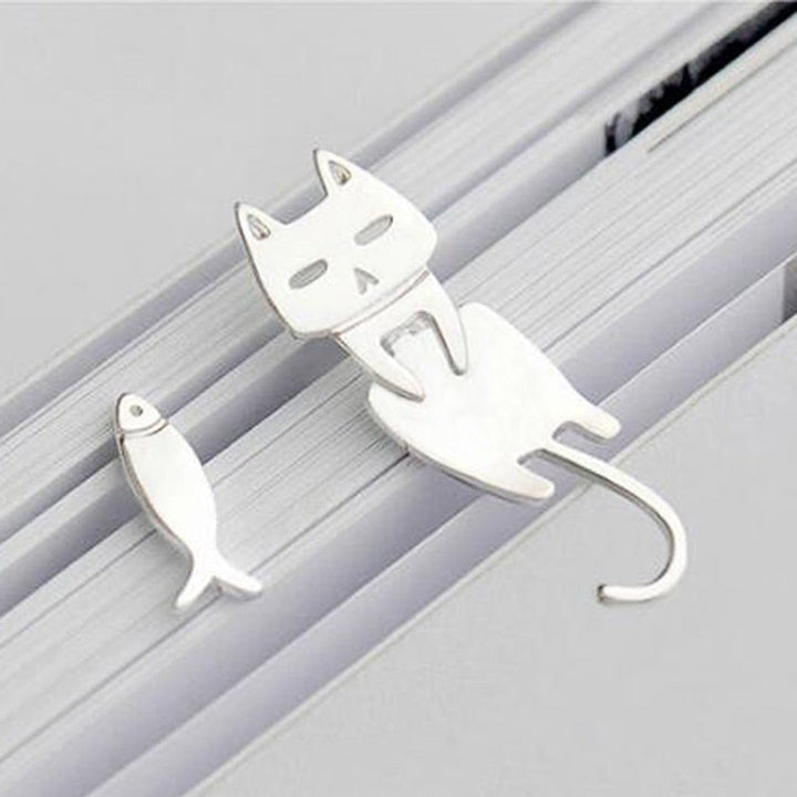Unique sterling silver climbing cat earrings. Whimsical feline design, a charming and playful accessory for women.