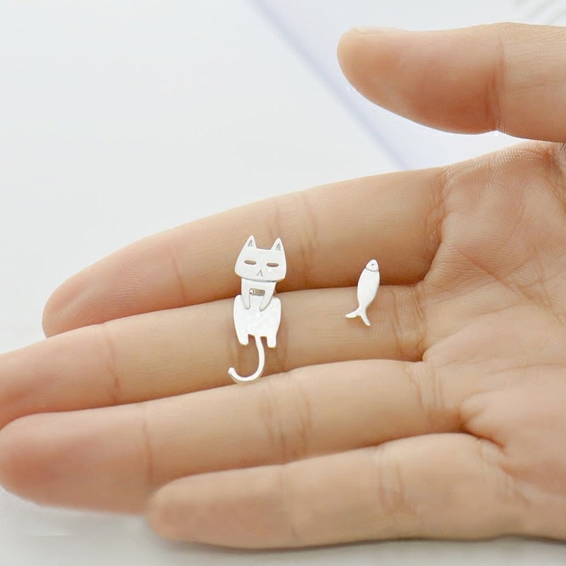 Dainty sterling silver climbing cat earrings. Feline themed jewelry, a playful and unique accessory for women.