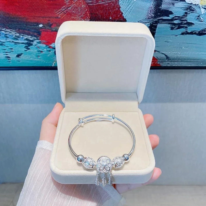 Sterling silver dreamcatcher bracelet for women, offering protection & elegant style.