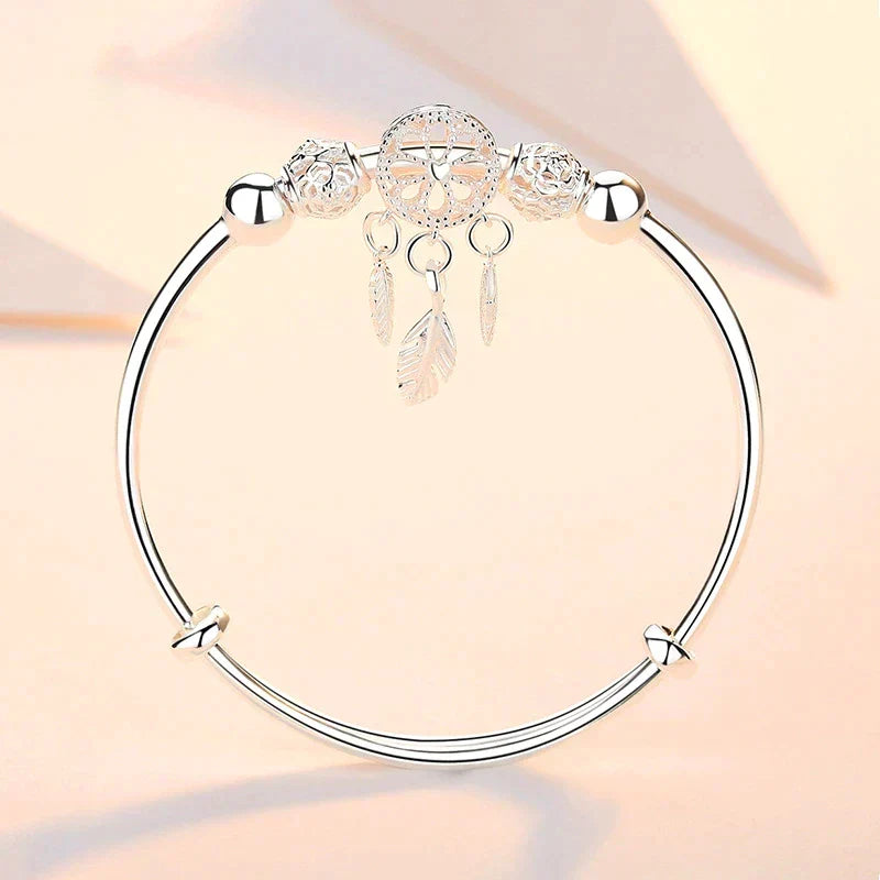 Spiritual sterling silver dreamcatcher charm bracelet, a thoughtful gift for protection & positivity.