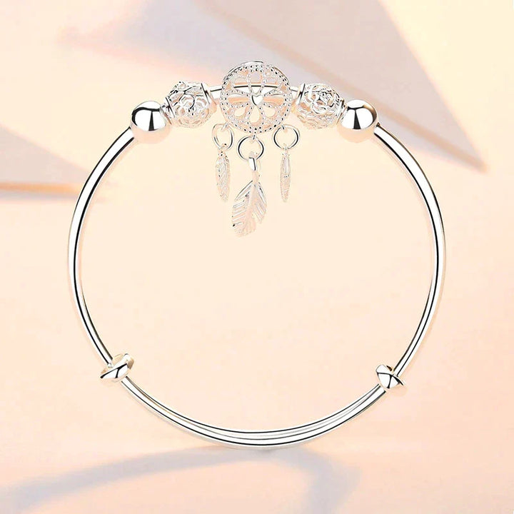 Spiritual sterling silver dreamcatcher charm bracelet, a thoughtful gift for protection & positivity.
