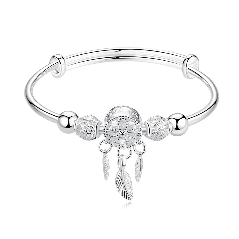 Elegant women's sterling silver dreamcatcher bracelet, a symbol of protection & delicate arm candy.