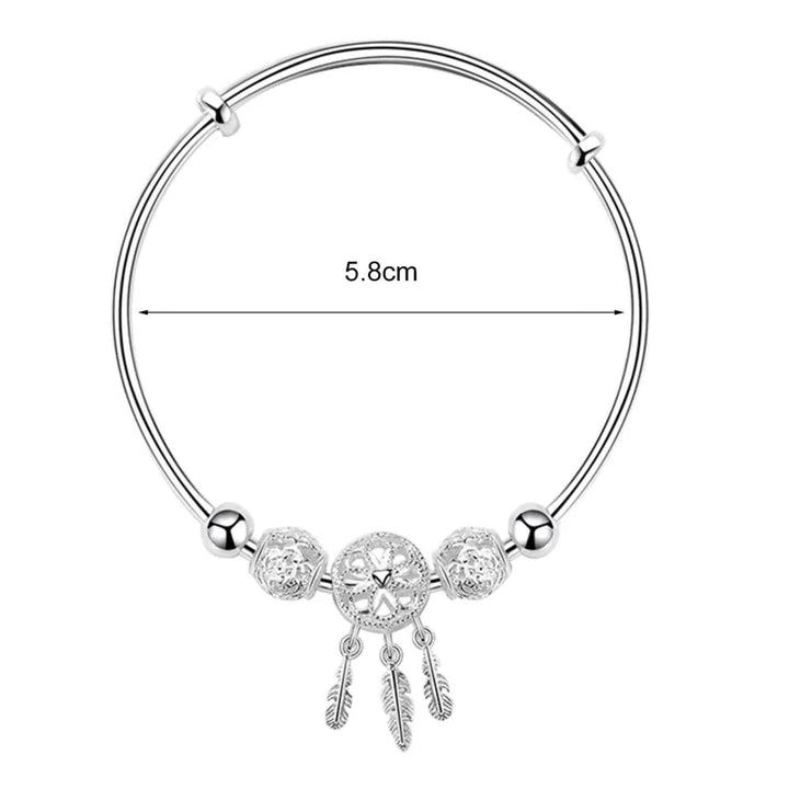 Crafted sterling silver dreamcatcher bracelet, a chic & protective charm for women's spiritual jewelry.