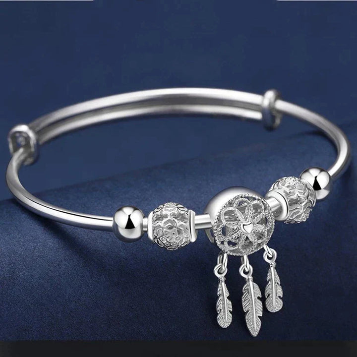 Women's sterling silver dreamcatcher jewelry bracelet, blending elegance with spiritual protection.