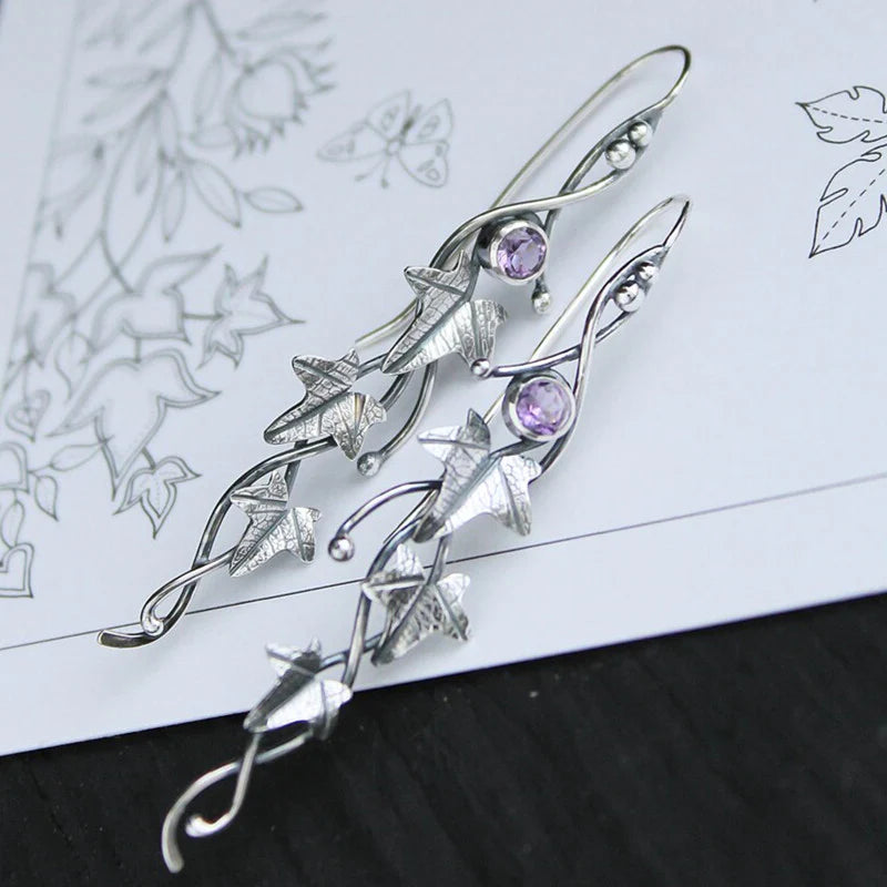 Elegant sterling silver elf leaf drop earrings, nature-inspired design. Delicate fantasy jewelry for women.