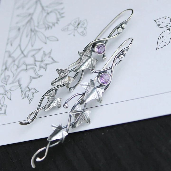 Elegant sterling silver elf leaf drop earrings, nature-inspired design. Delicate fantasy jewelry for women.