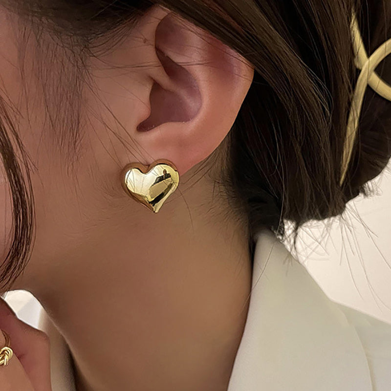 Elegant heart-shaped gold plated hook earrings, a timeless piece for women.