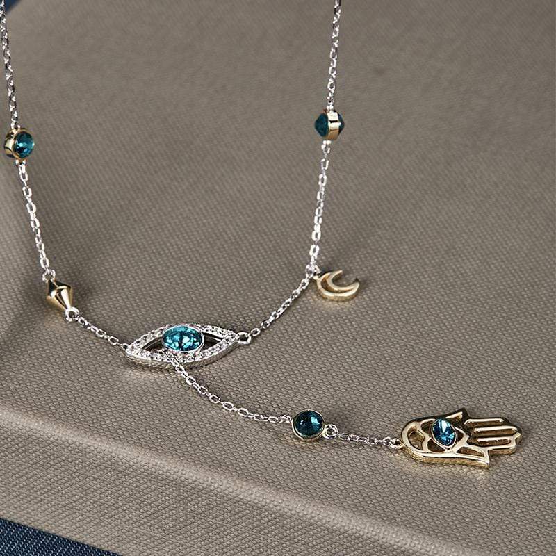 Polished silver Hamsa charm necklace adorned with clear crystals, a stylish women's accessory.