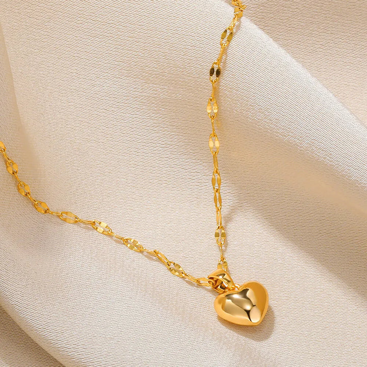 Versatile sterling silver heart pendant necklace, elegant fashion jewelry for women.