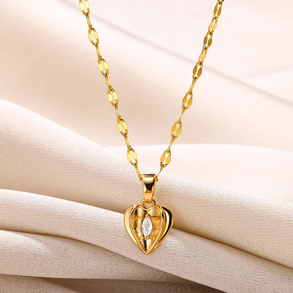 Polished sterling silver heart charm necklace, a classic elegant women's jewelry piece.