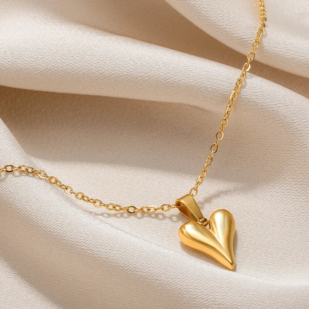Close-up of delicate sterling silver heart pendant necklace, elegant women's love charm.