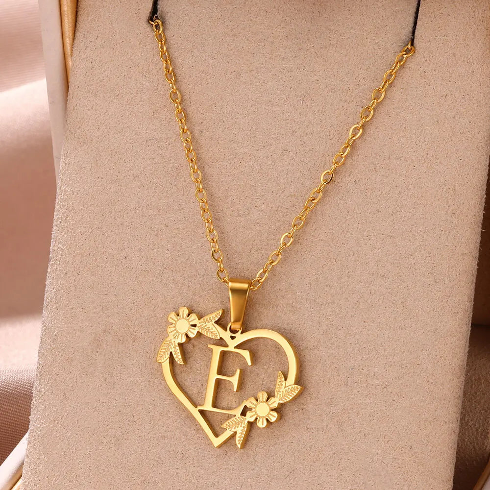 Close-up of a women's custom letter heart pendant, sterling silver. A personalized initial necklace, perfect for her.