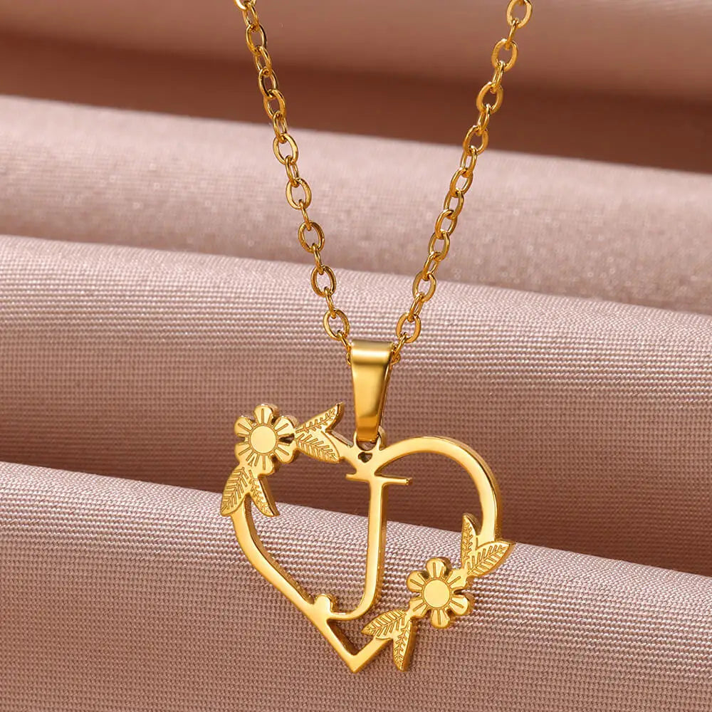 Exquisite personalized heart initial necklace. Sterling silver custom letter pendant, an ideal sentimental gift for women.