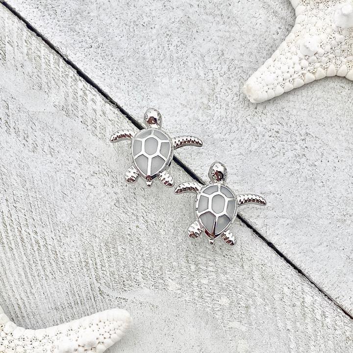 Elegant white opal sea turtle earrings for women in sterling silver. Perfect ocean-inspired animal jewelry gift.