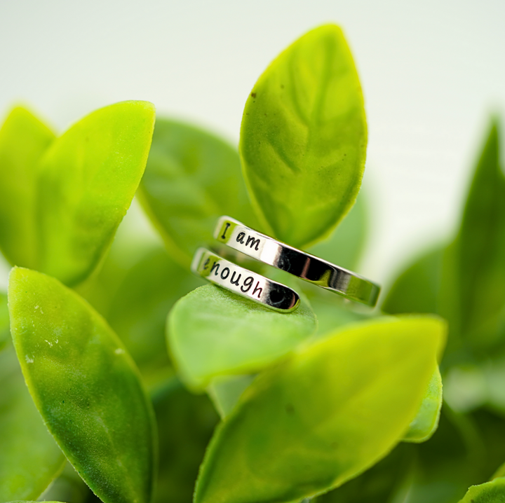 Elegant sterling silver 'I Am Enough' ring for women. Inspirational jewelry, promoting self-love & mental well-being.