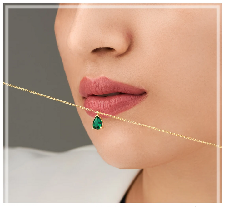 Stunning women's emerald drop necklace. Elegant sterling silver fine jewelry with a vibrant gemstone, perfect for gifts.
