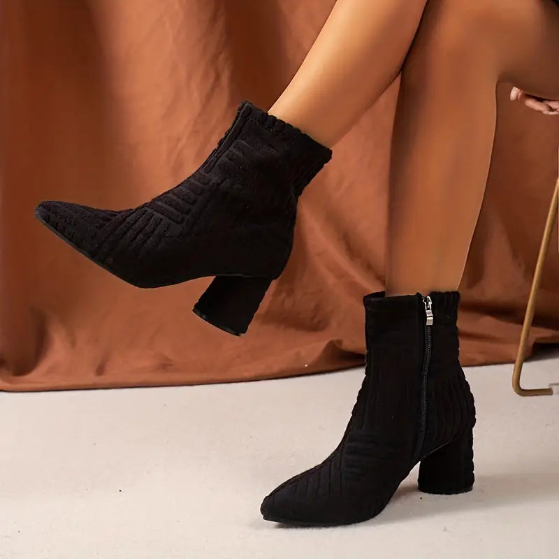 Stylish black ladies' ankle boots with a comfortable block heel and pointed toe.