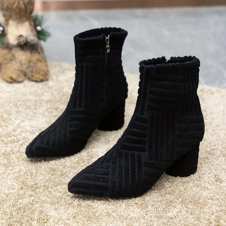 Elegant black ladies' ankle boots with a pointed toe, block heel, and zip for easy wear.