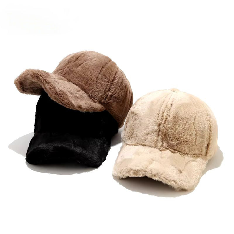 Stylish black plush faux fur women's winter cap, warm & cozy for cold weather. Adjustable design.