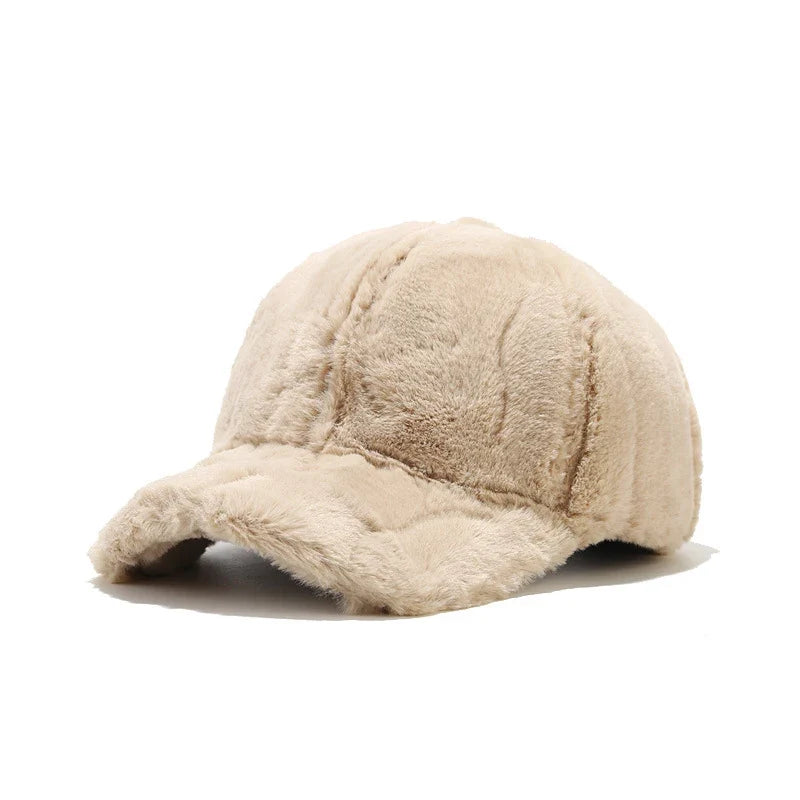 Luxurious white plush faux fur cap for women. Stylish and warm winter headwear for cold weather.
