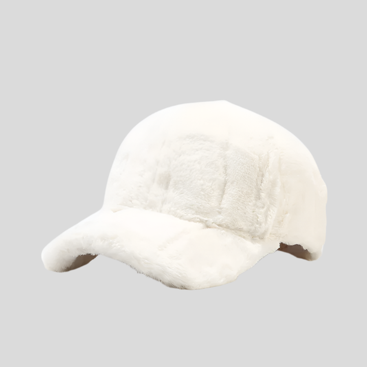 Soft plush faux fur women's winter cap, cozy and warm. Stylish headwear for cold weather.