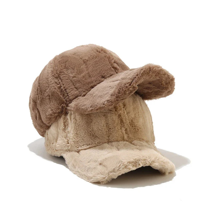 Adjustable women's plush faux fur winter cap. Warm and stylish headwear, perfect for cold weather.