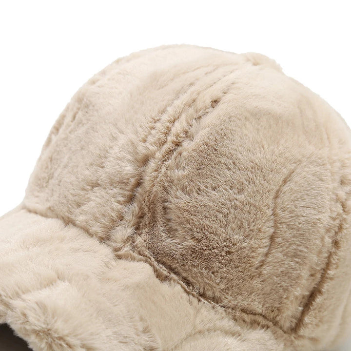 Fashionable women's faux fur winter cap, plush and warm. Essential headwear for cold weather protection.